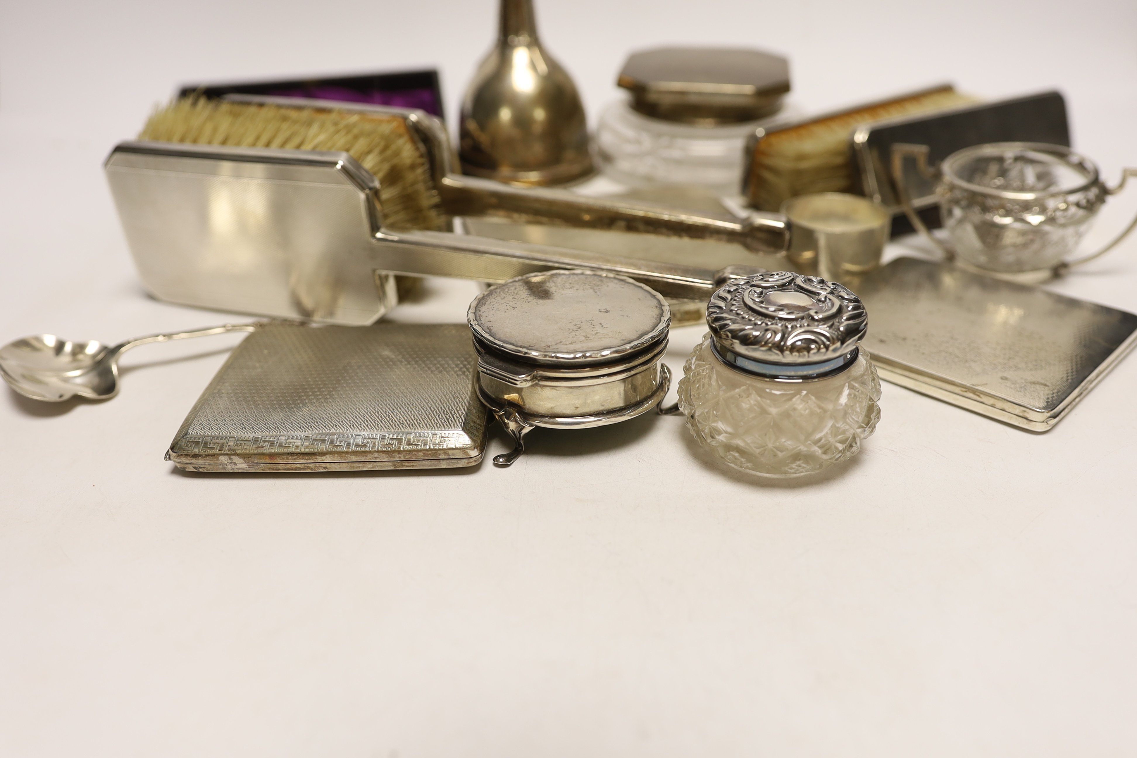 A group of assorted small silver, including a powder jar, trinket box, cigarette case, mirror and brush set etc. and a plated wine funnel.